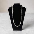 Long pearl necklace